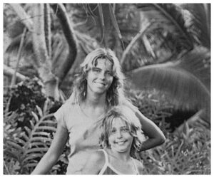 Dana (front) as a child with her sister, Sandy (back).