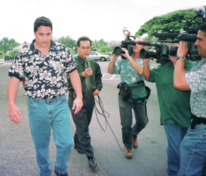 Shawn Schweitzer Walking Into the Courthouse Surrounded by Media.