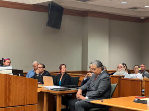 Shawn and Ian Schweitzer with their legal team during the hearing.